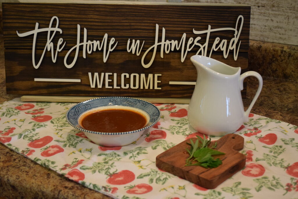 Tomato Rhubarb Soup / Tomato Gazpacho in front of a The Home in Homestead Sign