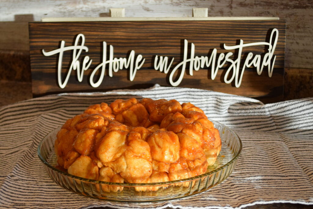 Golden Pudding Monkey Bread in front of a The Home in Homestead Sign
